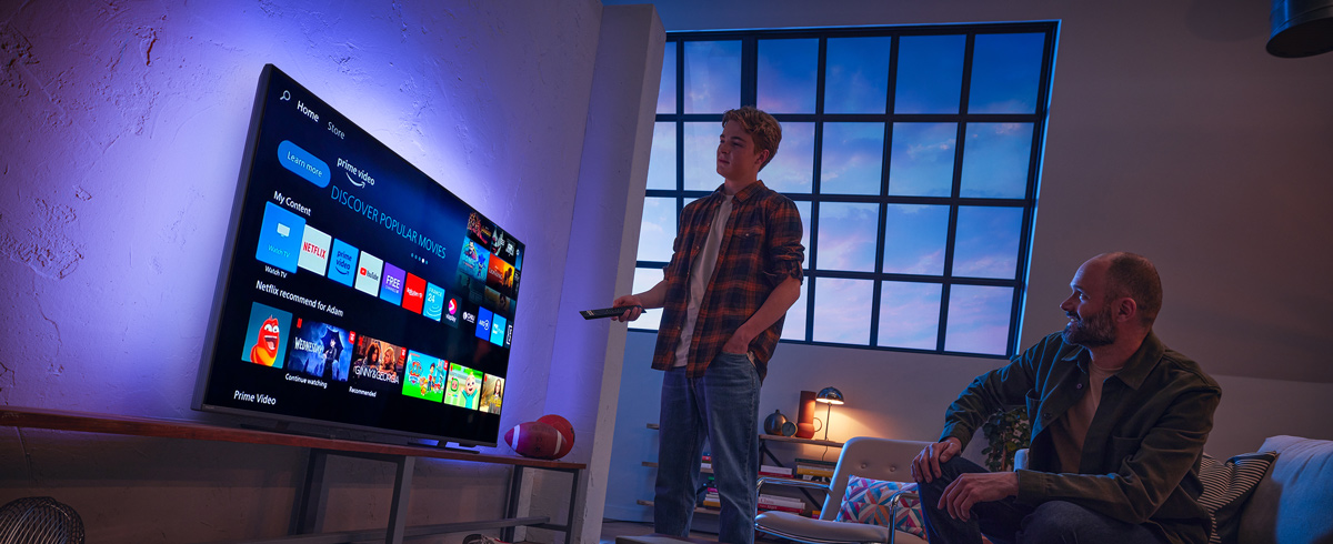 A man choosing app from Philips Smart TV